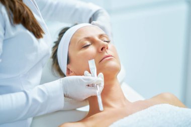 Woman in a beauty salon having face and body treatment. High quality photo