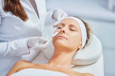 Woman in a beauty salon having face and body treatment. High quality photo