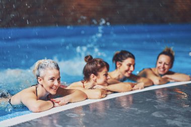 Group of woman in pool having training. High quality photo