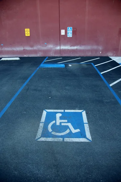 Handicap Parking Space. Handicap Placard. Wheel Chair Logo. Reserved Parking Space. No Parking unless permuted.