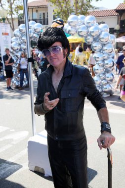 Garden Grove, California - USA - October 9, 2022: 22nd Annual ELVIS FESTIVAL. People Celebrate Elvis Presley in Garden Grove California at the 22nd Annual Elvis Festival. Elvis impersonators help.