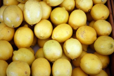 fresh ripe lemons as background, close up