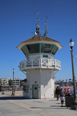 Huntington Beach, CA. - USA - September 19, 2022: Life Guard Station. Huntington Beach Life Guard Station on the Huntington Beach Pier. Life Guards watch and support Swimmers and Surfers in the water. 