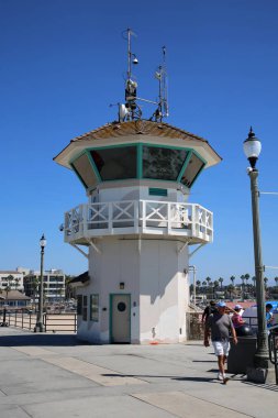 Huntington Beach, CA. - USA - September 19, 2022: Life Guard Station. Huntington Beach Life Guard Station on the Huntington Beach Pier. Life Guards watch and support Swimmers and Surfers in the water. 