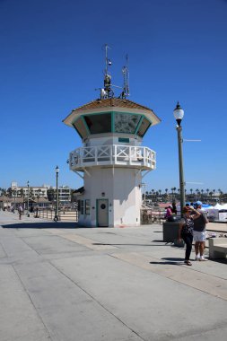 Huntington Beach, CA. - USA - September 19, 2022: Life Guard Station. Huntington Beach Life Guard Station on the Huntington Beach Pier. Life Guards watch and support Swimmers and Surfers in the water. 