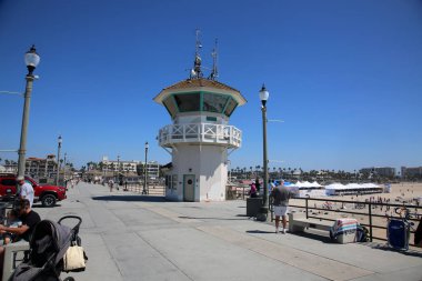 Huntington Beach, CA. - USA - September 19, 2022: Life Guard Station. Huntington Beach Life Guard Station on the Huntington Beach Pier. Life Guards watch and support Swimmers and Surfers in the water. 