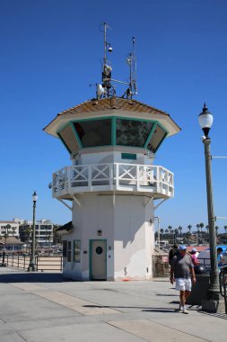 Huntington Beach, CA. - USA - September 19, 2022: Life Guard Station. Huntington Beach Life Guard Station on the Huntington Beach Pier. Life Guards watch and support Swimmers and Surfers in the water. 