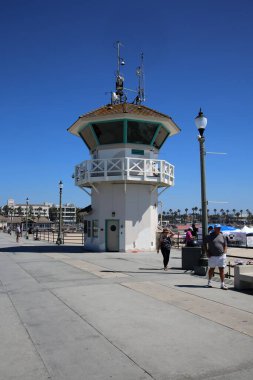 Huntington Beach, CA. - USA - September 19, 2022: Life Guard Station. Huntington Beach Life Guard Station on the Huntington Beach Pier. Life Guards watch and support Swimmers and Surfers in the water. 