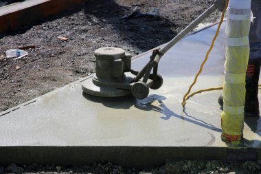 Irvine, California - USA - June 2, 2022: Construction Site. Workmen working on a construction site. Floor Scrubbers, Power Washers, Steam Cleaning construction work. Theme Park Construction Site