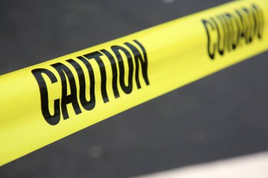 Caution Tape. Yellow Caution Tape. Caution, Cuioado plastic tape. Do not enter tape. Warning sign.