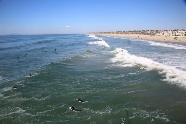 Surfing. People surfing in Huntington Beach California. Surfs Up.