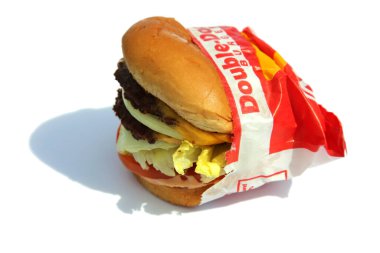 Lake Forest, California - USA February 25, 2023. IN-N-OUT Burgers. Double Double Cheese Burger. Isolated on white. Room for text. Cheese Burgers are enjoyed world wide by people for Lunch and Dinner.