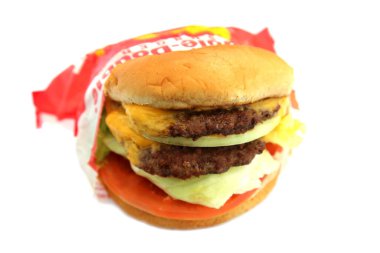 Lake Forest, California - USA February 25, 2023. IN-N-OUT Burgers. Double Double Cheese Burger. Isolated on white. Room for text. Cheese Burgers are enjoyed world wide by people for Lunch and Dinner.