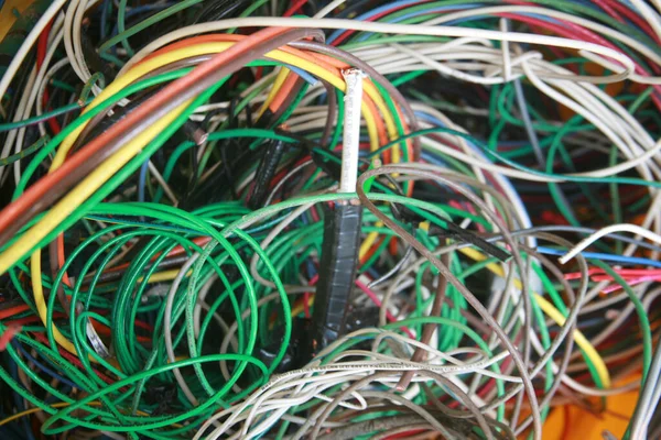 stock image Lake Forest, California - USA - May 7 2023: Copper wire. Scrap electrical wire for recycling. Old electrical wire. Messy pile of colorful cables network chaos of multicolor wires. Construction waste