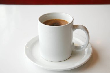 - Kahve. Bir fincan kahve. Eski bir mutfak masasında kahve fincanı. Sütlü beyaz fincan kahve. Günaydın, beni al. Bir fincan Joe. Kafein. Krema ve şekerli Java. Seramik bardakta espresso..