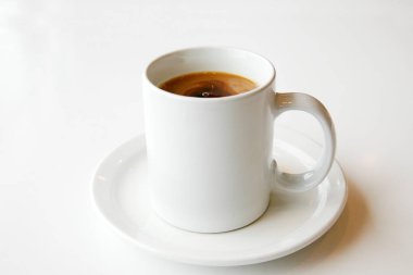 - Kahve. Bir fincan kahve. Eski bir mutfak masasında kahve fincanı. Sütlü beyaz fincan kahve. Günaydın, beni al. Bir fincan Joe. Kafein. Krema ve şekerli Java. Seramik bardakta espresso..