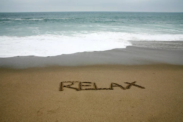 Relax Written Beach Sand Ocean Background — Stock Photo, Image