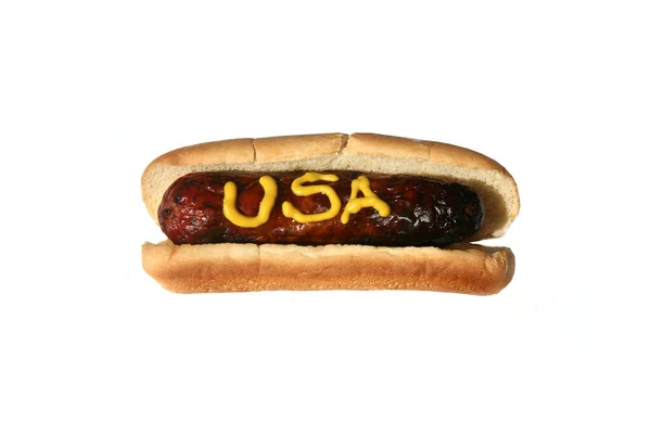 热狗的文字写在黄色芥末 午餐的热狗 与白种人隔离 — 图库照片