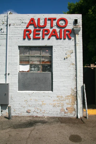 Auto Repair sign on the building. Mechanic. Auto repair shop. Auto repair service sign. The automotive industry