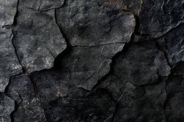 Tasarım için arka plan olarak siyah çimento desenli çatlamış beton duvar.