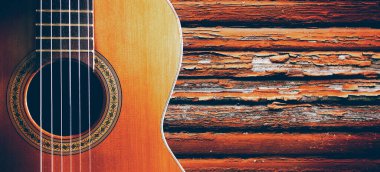 İspanyol gitar ve ahşap duvar. Müzik arka plan