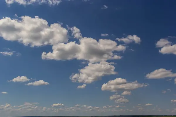 stock image clouds in the sky lit by the sun on a summer day. background.