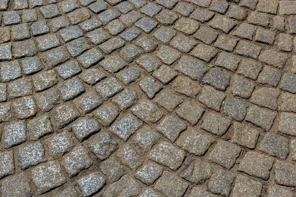 石畳の道だ 灰色の石畳のテクスチャ ヴィンテージ道路表面 — ストック写真