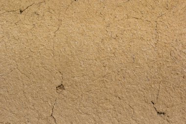 Dokulu arka plan. Dekoratif alçı duvarlar, dış cephe dekorasyonu. Bej rengi.