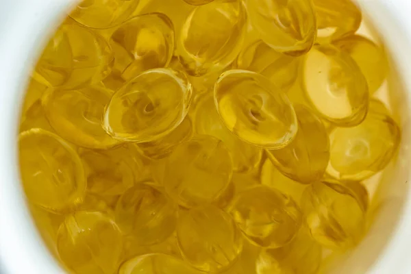Viele Gelbe Gelatinekapseln Auf Hellem Hintergrund Omega Viren Nahaufnahme Makro — Stockfoto