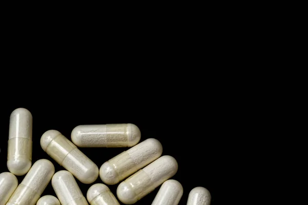 Witte Capsules Pillen Een Zwarte Achtergrond Met Plaats Voor Tekst — Stockfoto