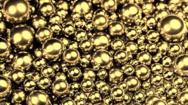 golden steel balls turning on a rotary table, closeup