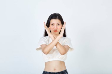 Beautiful young Asian woman Break the bias symbol of woman's international day. Crossed hands