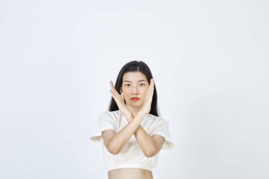 Beautiful young Asian woman Break the bias symbol of woman's international day. Crossed hands