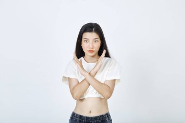 Beautiful young Asian woman Break the bias symbol of woman's international day. Crossed hands