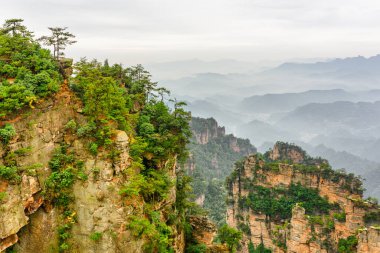 Natural quartz sandstone pillars of the Tianzi Mountains (Avatar Mountains) in the Zhangjiajie National Forest Park, Hunan Province, China. Summer landscape. clipart