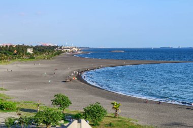 Awesome aerial view of Cijin Beach at Cijin Island in Kaohsiung, Taiwan. The beach is a popular recreational gathering place among residents and tourists of Asia. clipart
