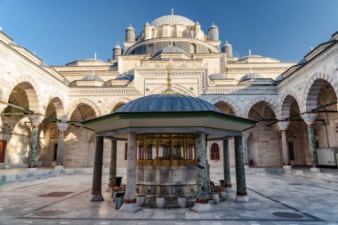 Awesome view of ablution fountain in the middle of courtyard of the Bayezid II Mosque in Istanbul, Turkey. The mosque is a popular destination among pilgrims and tourists of the world. clipart