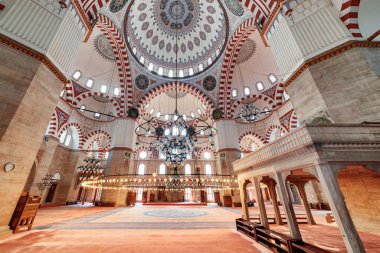 Istanbul, Turkey - September 17, 2021: Awesome interior of prayer hall in the Sehzade Mosque. The Ottoman imperial mosque is a popular destination among tourists and pilgrims in the world. clipart