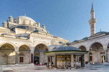 Awesome view of ablution fountain in the middle of courtyard of the Bayezid II Mosque in Istanbul, Turkey. The mosque is a popular destination among pilgrims and tourists of the world. clipart