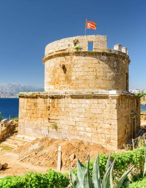 Awesome view of Hidirlik Tower in Kaleici of Antalya, Turkey. The Kaleici area is the historic city center and a popular tourist attraction in Turkey. clipart