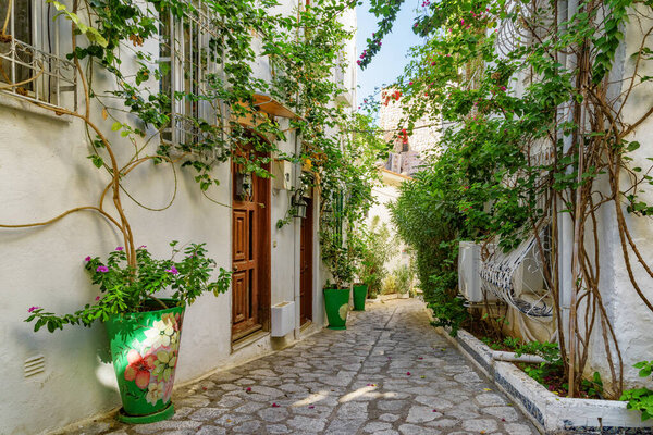 Awesome view of a cozy narrow street in Marmaris, Turkey. Scenic white houses of the old town. The port city is a popular tourist destination in the Turkish Riviera.