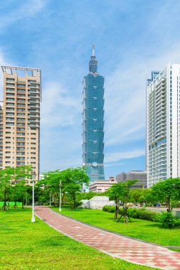 Taipei, Taiwan - April 25, 2019: Amazing view of Xiangshan Park, Taipei 101 (Taipei World Financial Center) and modern residential buildings. The tower is a supertall skyscraper and landmark of Taiwan clipart