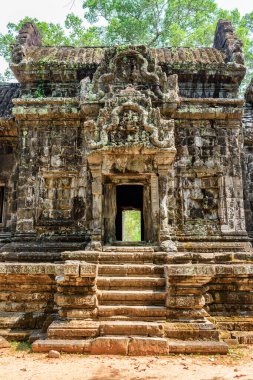 Ancient buildings of Thommanon temple in enigmatic Angkor, Siem Reap, Cambodia. Mysterious Thommanon nestled among rainforest. Angkor wat is a popular tourist attraction. clipart