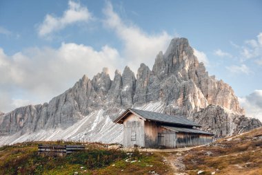Wooden cabin at the Tre Cime di Lavaredo National Park near rifugio Locatelli in Dolomite Alps. Three peaks of Lavaredo, Dolomites, South Tyrol, Italy, Europe. Landscape photography clipart