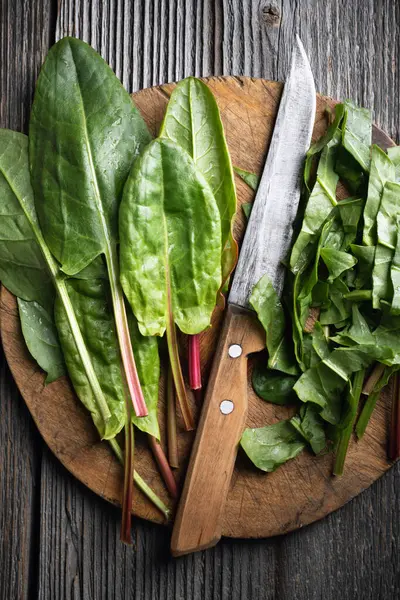 Cutting Fresh Organic Sorrel Leaves Wooden Board Knife Close Food — Stock Photo, Image