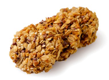 Beyaz arka planda tohumlu yulaflı kurabiyeler. Sağlıklı beslenme