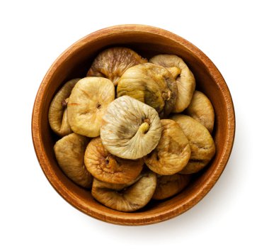 Dried figs in a wooden plate close-up on a white background. Top view
