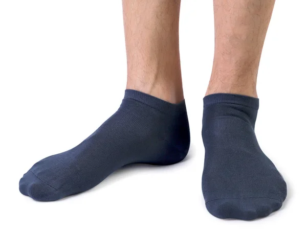 白い背景に男性の足の近くに黒い靴下 — ストック写真