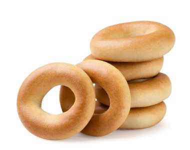 Beyaz arka planda yakın plan simitleri kurutuyorum. İzole edilmiş