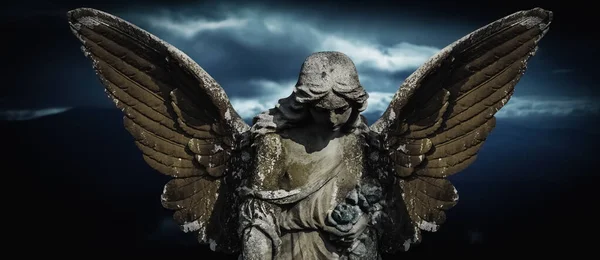 Death concept. Angel crying as symbol of pain, fear and end of human life. Hprizontal image.
